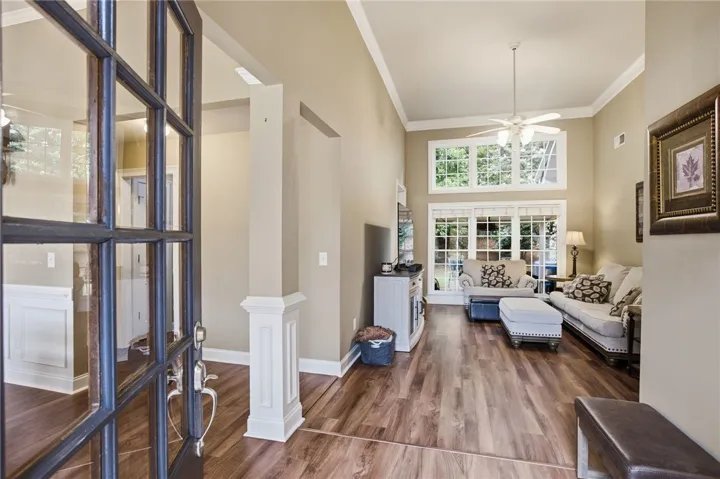 Enter into a naturally illuminated living area.