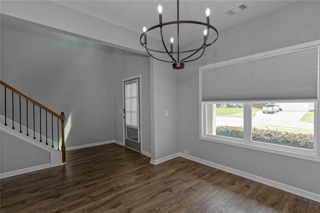 Wood flooring and ample natural light define this welcoming entry space.