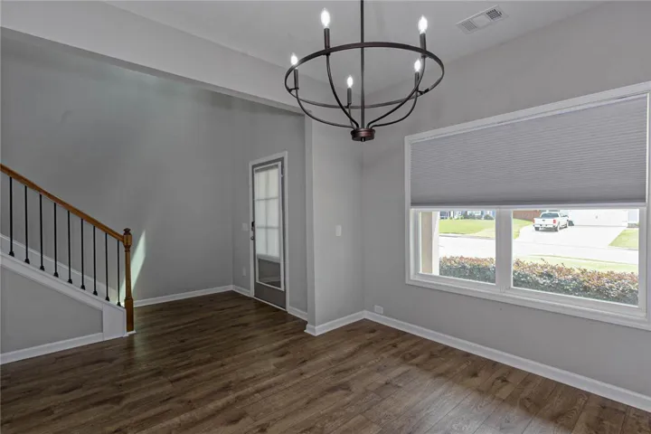 Wood flooring and ample natural light define this welcoming entry space.