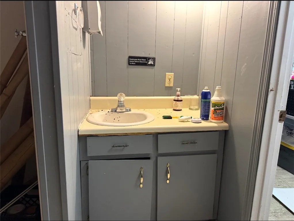 A functional bathroom vanity with built-in storage offers practicality and convenience.