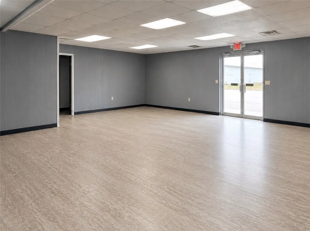 A versatile open-plan space with durable vinyl flooring, ready for various commercial ventures.