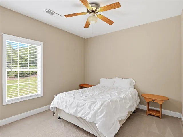Well-lit sleeping quarters with outdoor views, offering comfort and serenity.