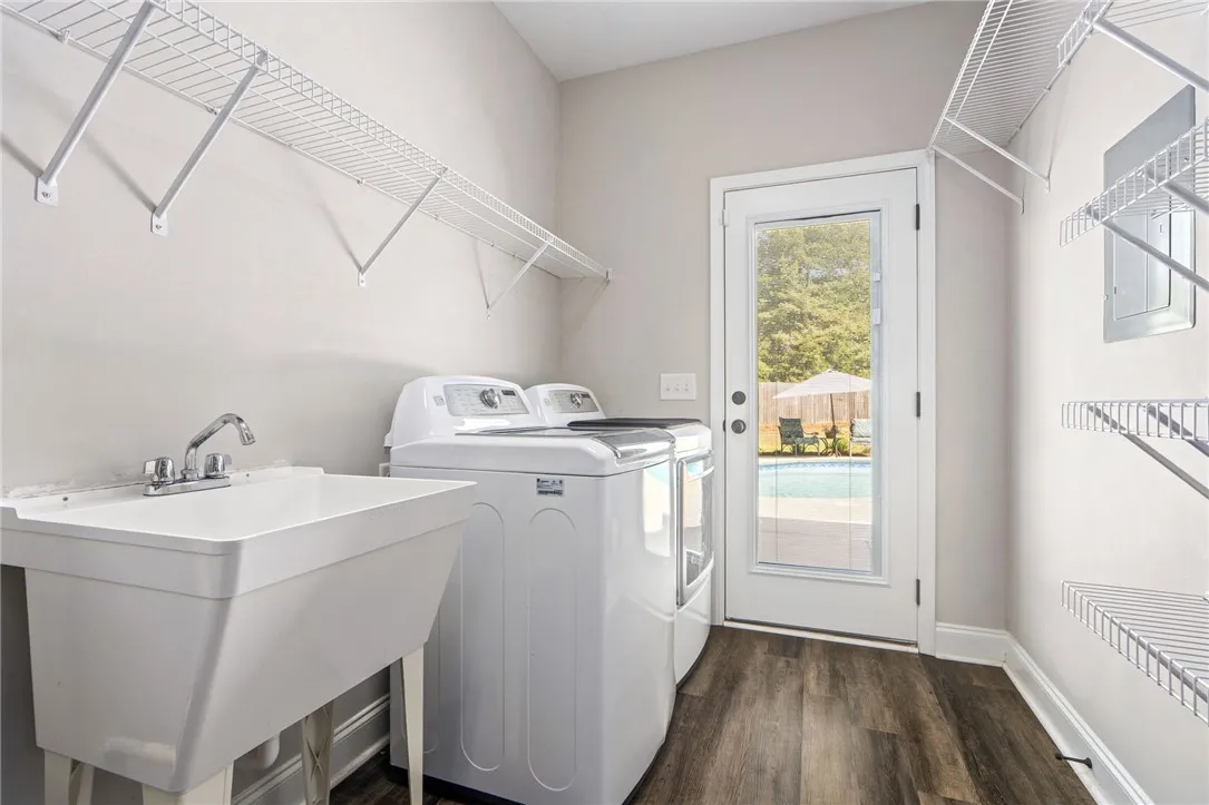 Functional laundry space with convenient outdoor access to the pool area.