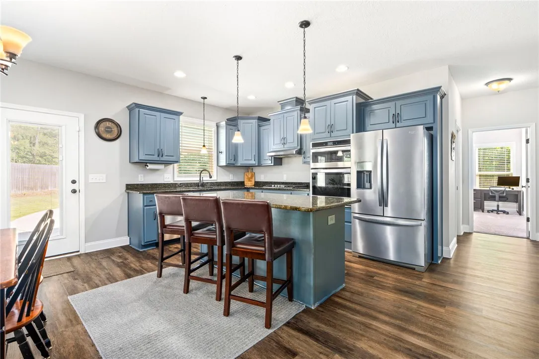 Culinary creations come to life in this contemporary kitchen, featuring an island for entertaining.