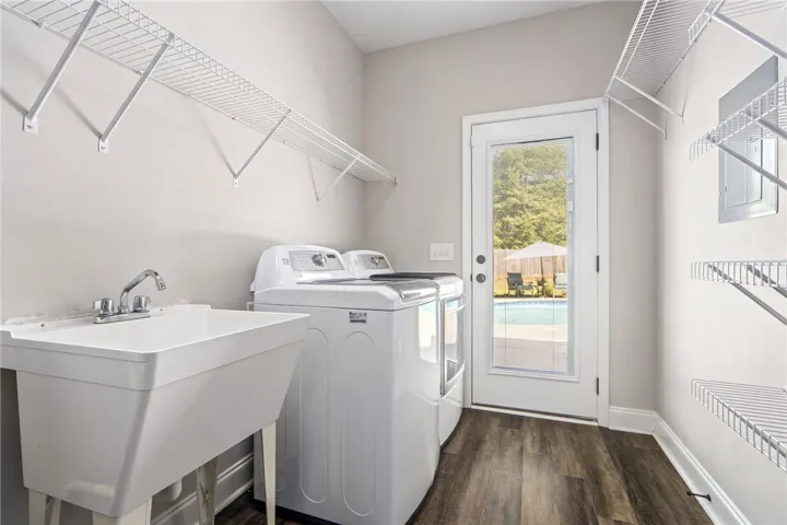 Functional laundry space with convenient outdoor access to the pool area.