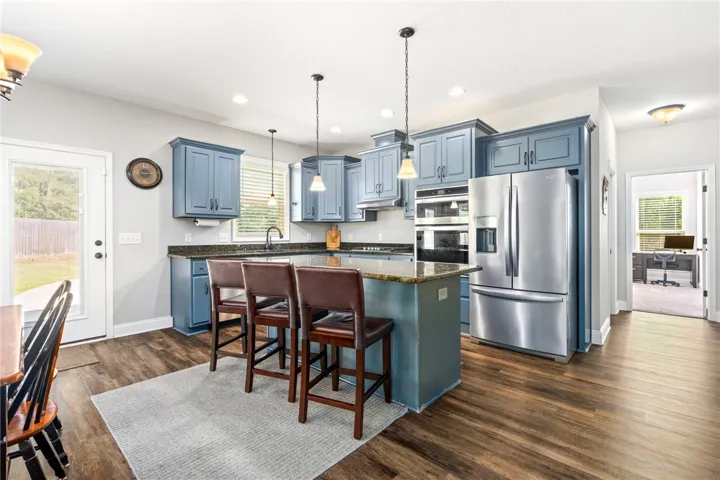 Culinary creations come to life in this contemporary kitchen, featuring an island for entertaining.