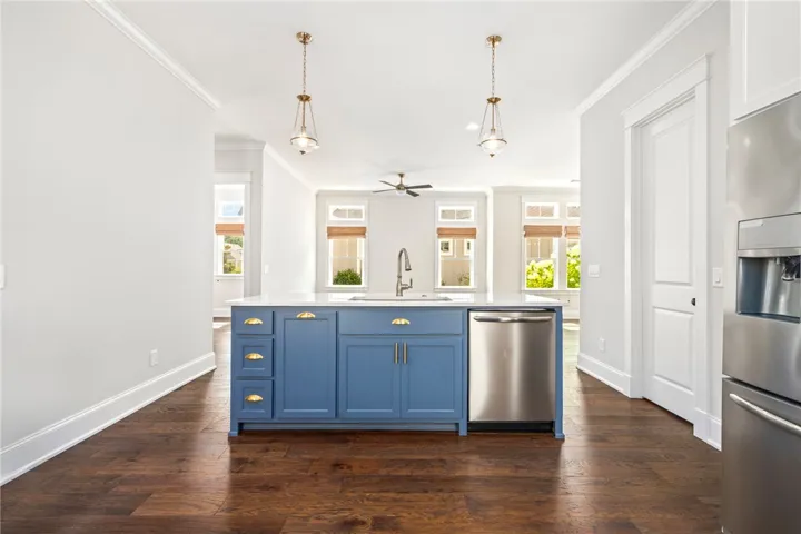 The upscale kitchen steals the spotlight with its stunning cabinetry and finishes.