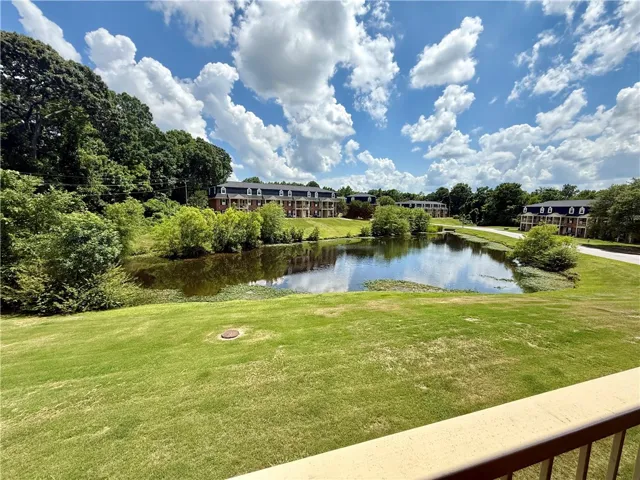 Lush landscaping and a serene pond enhance this community, creating a tranquil setting for residents.