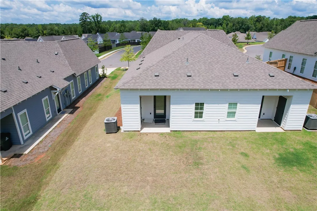 A well-maintained lawn stretches behind these inviting single-story homes with clean, modern exteriors.