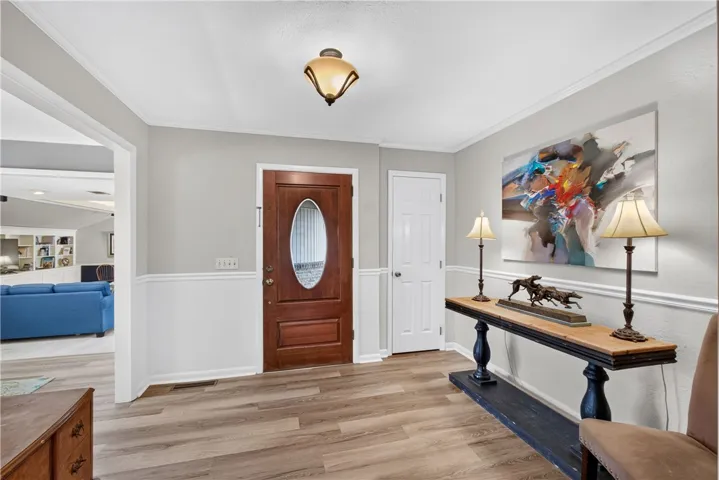 A welcoming entryway with durable flooring sets a refined tone.