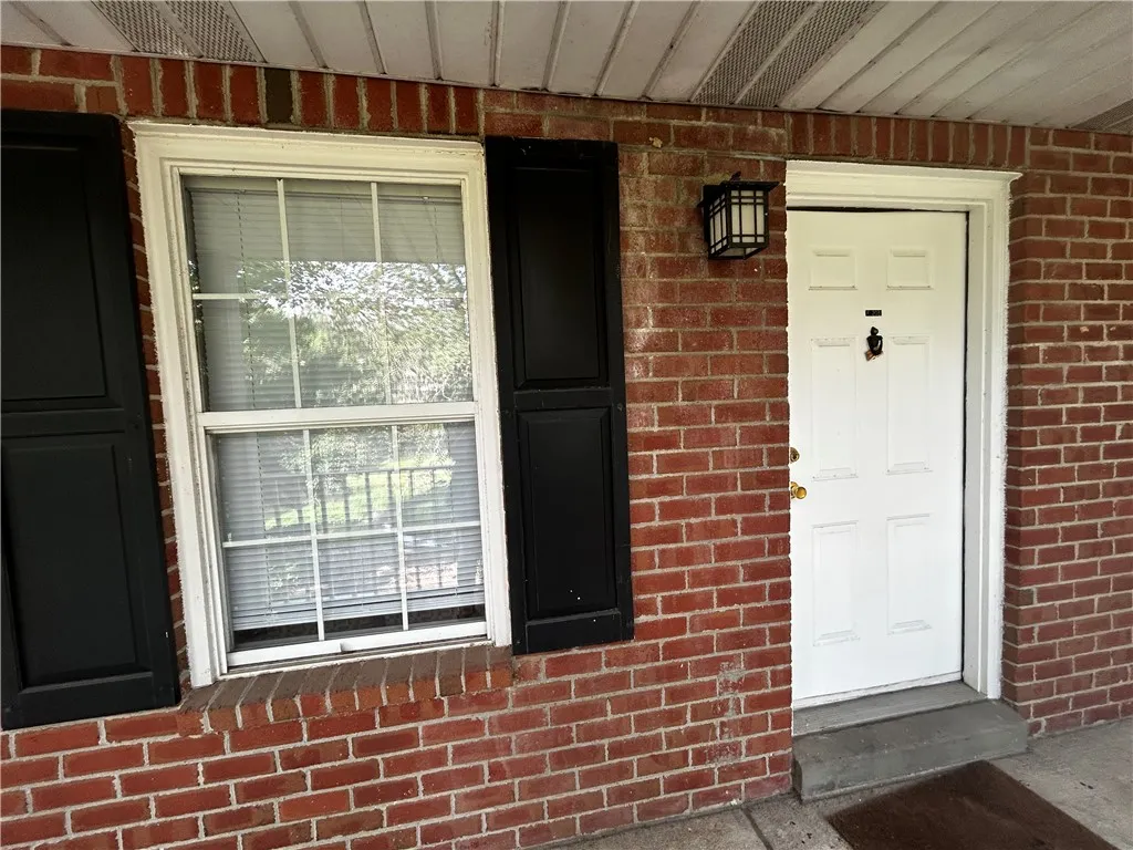 A classic brick exterior offers timeless appeal and a welcoming entryway.