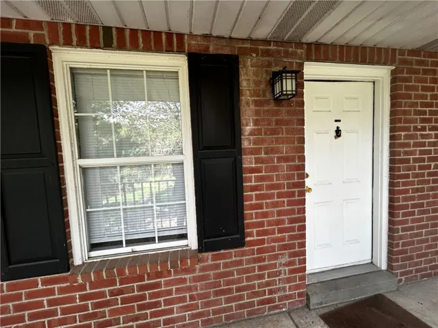 A classic brick exterior offers timeless appeal and a welcoming entryway.