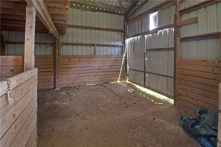 A spacious barn provides ample room and a sturdy shelter for various farm activities.