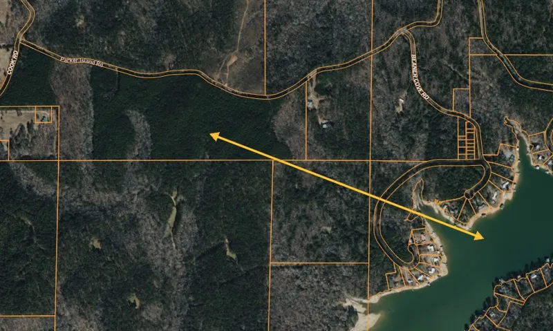 Discover a tranquil lakeside parcel with abundant trees and convenient road access.