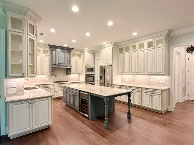 Culinary dreams come alive in this kitchen featuring abundant cabinetry, ample counter space, and a generous central island.