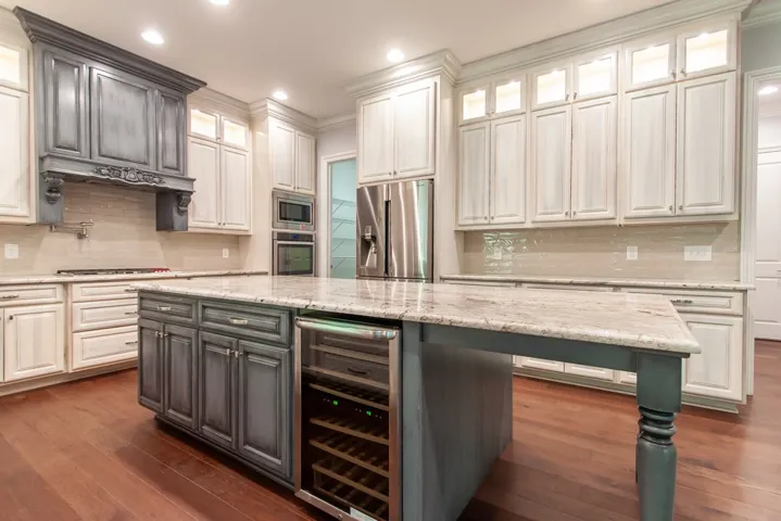 Culinary delights await in this chef's kitchen featuring premium appliances and abundant counter space.