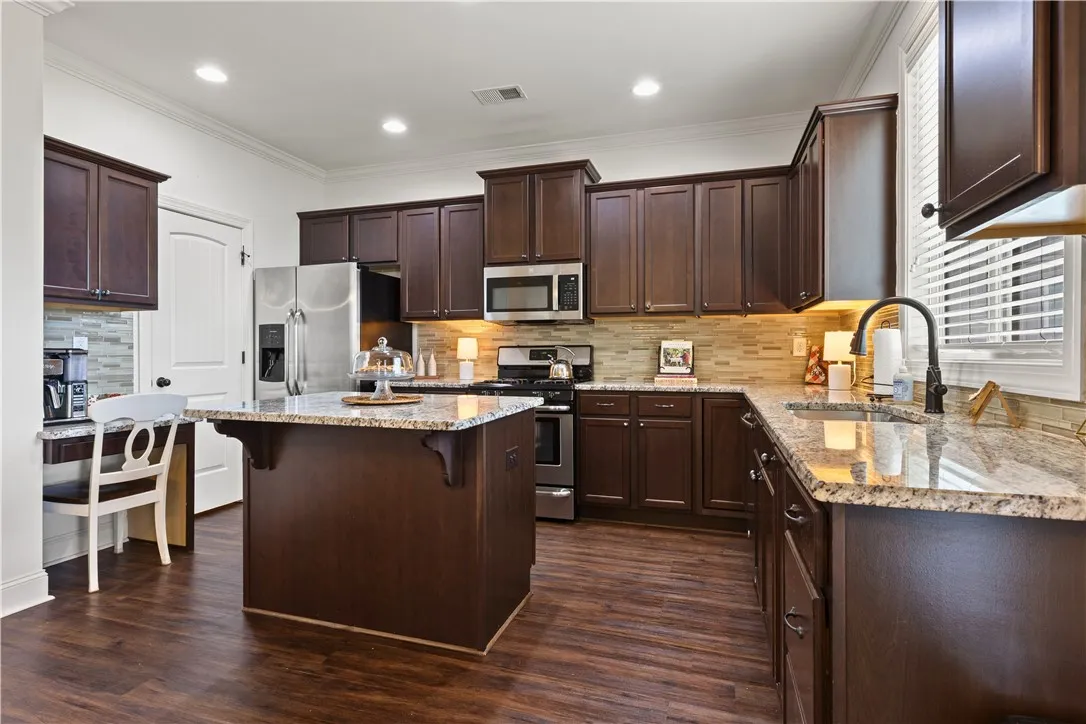 The island provides more counter space, storage, and dining.
