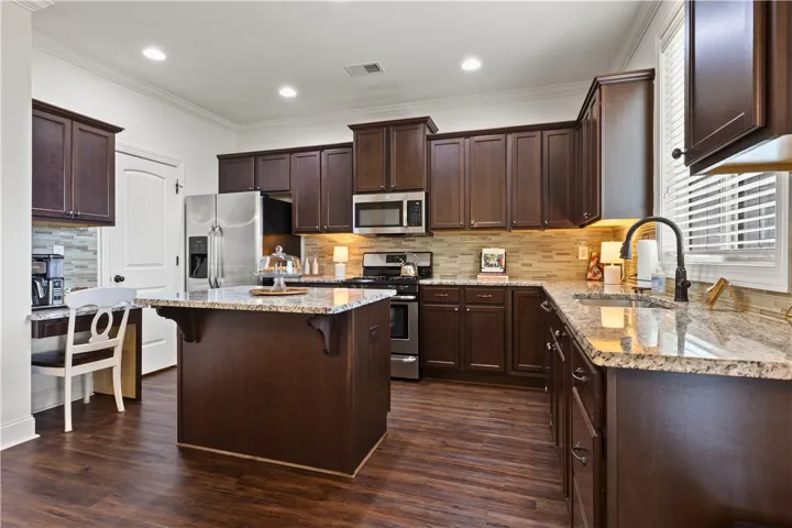The island provides more counter space, storage, and dining.