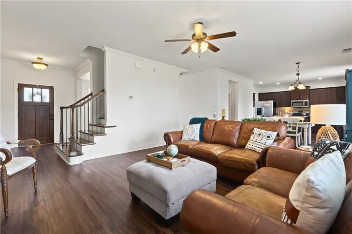 View of front door, foyer, and living room