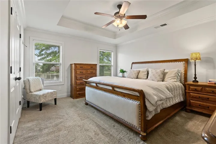 Primary bedroom ensuite with a walk-in closet