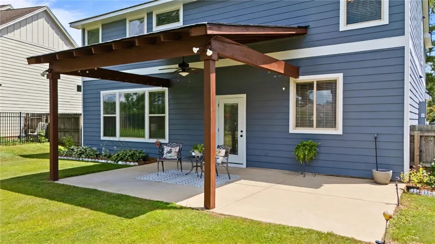 Back patio provides both shade and sun plus room for a grill