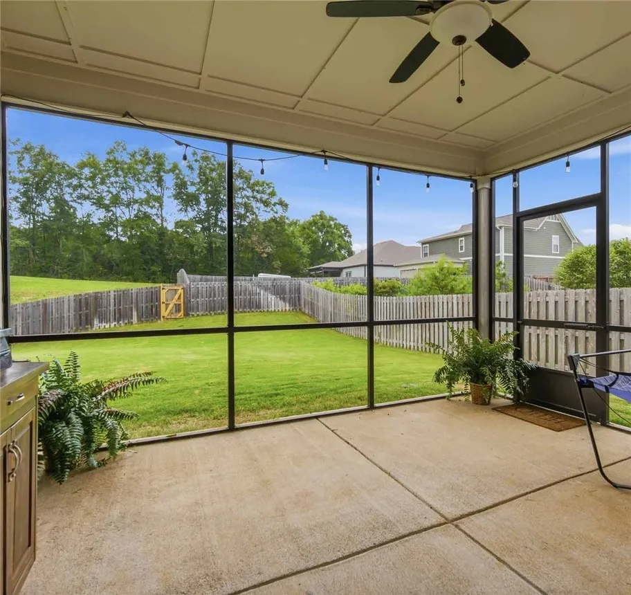 Enjoy outdoor living with a spacious screened-in patio and fenced private yard.