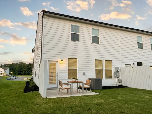 A quaint patio area offers a private outdoor retreat for relaxation and entertainment.