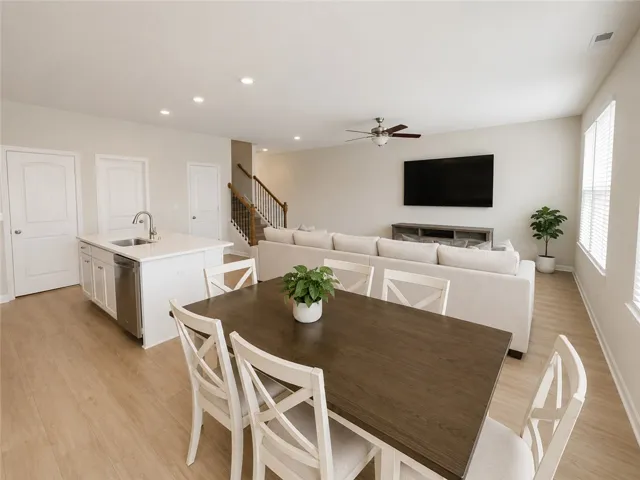 An inviting open-concept layout unites the kitchen and living areas, perfect for entertaining.