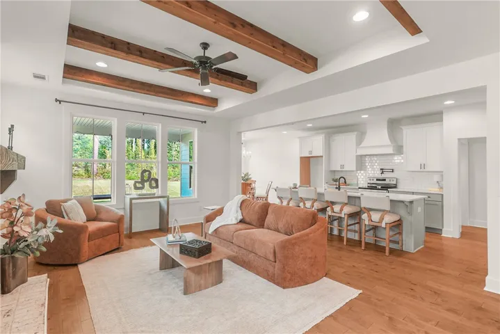 Large windows overlook the backyard and make the space feel bright and inviting
