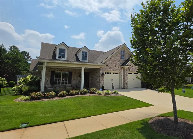Beautiful brick exterior & welcoming front porch!