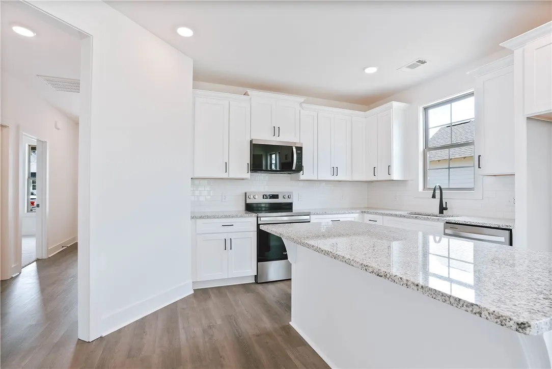 Example - "L" shaped kitchen with Large Center Island & Granite Countertops
- All plans, specifications & pricing are subject to change without notice.
