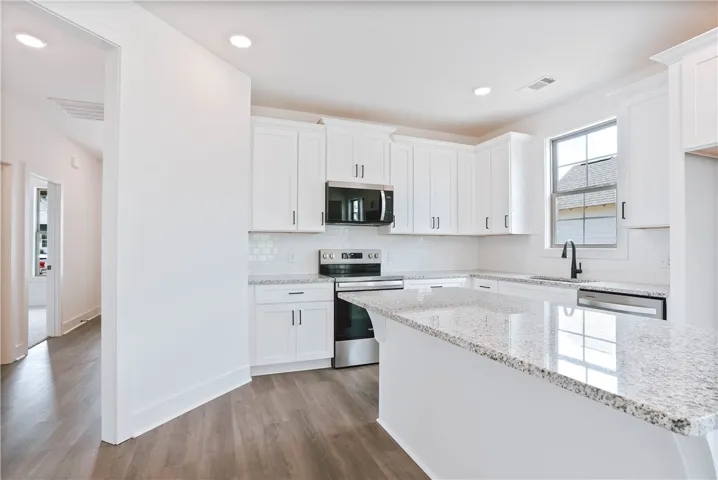 Example - "L" shaped kitchen with Large Center Island & Granite Countertops
- All plans, specifications & pricing are subject to change without notice.