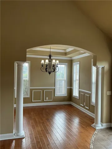 dining room with detailed molding.