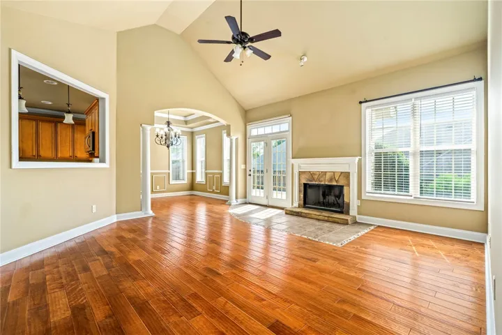 Large living with vaulted ceiling and wood burning fireplace