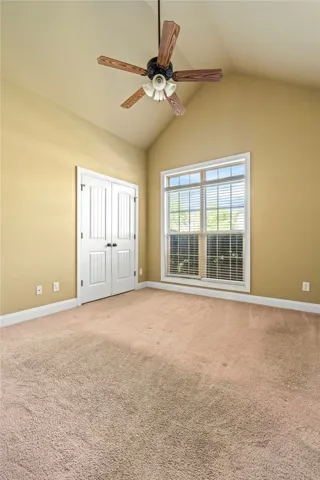 Secondary bedroom with vault ceiling