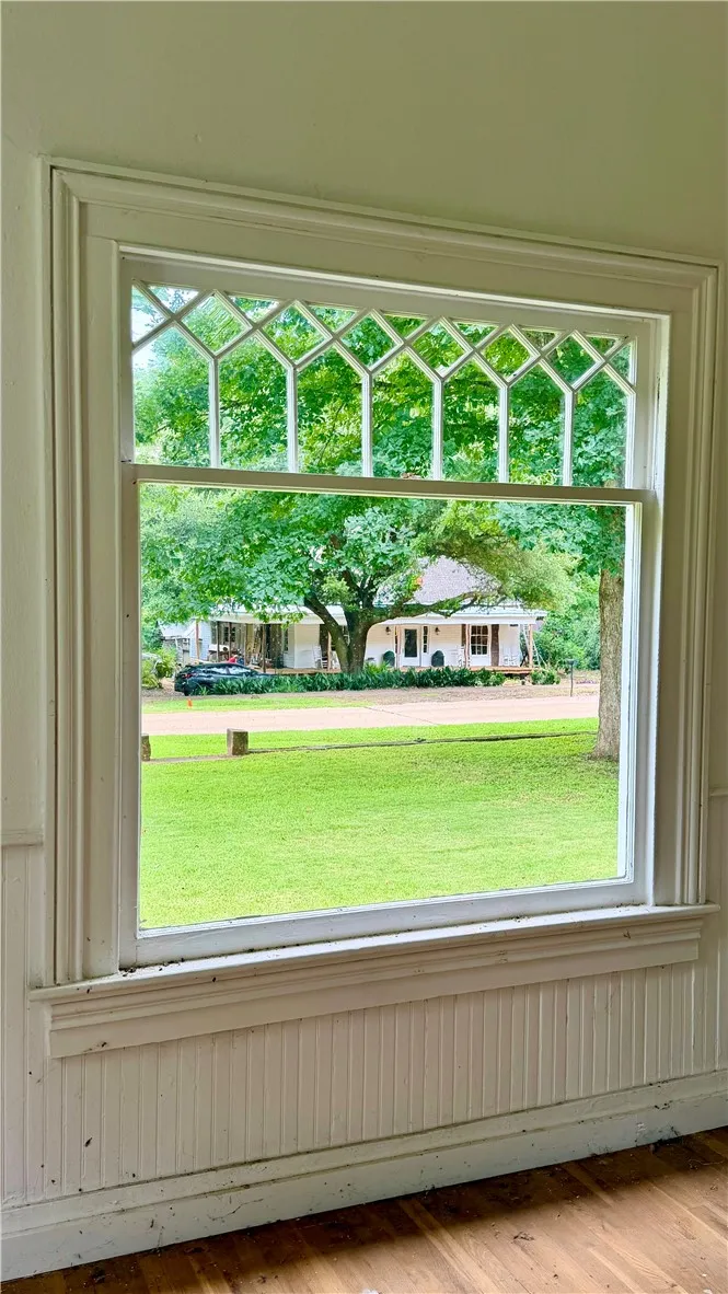 There are two picture windows on the front of the house...the arched grills above the window feature vintage rolled glass.