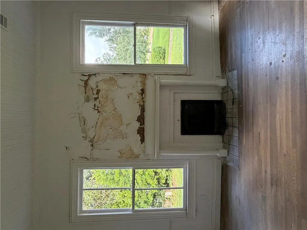 Another photo of the front left bedroom fireplace.