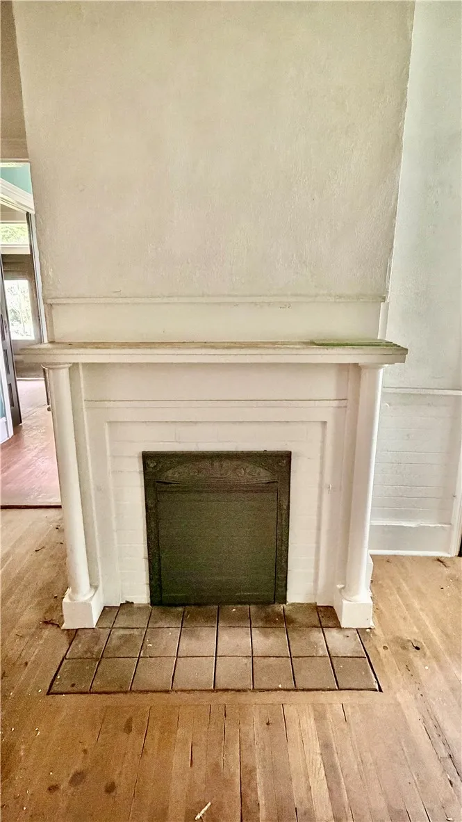 This fireplace is in the third bedroom.  Please note that NONE of the four fireplaces are function based on age.  Ornamental only.