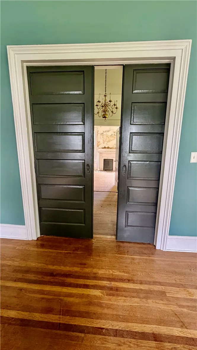 Another view of the pocket doors from inside the the front right bedroom.