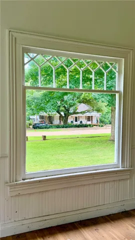 There are two picture windows on the front of the house...the arched grills above the window feature vintage rolled glass.