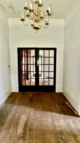 The view is from the front door.  The wide entry hall is inviting.