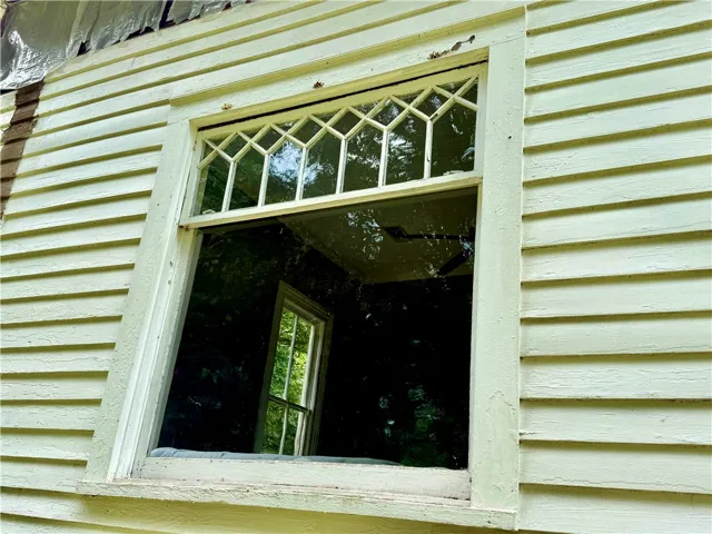 Outdoor view of one of the two front picture windows.