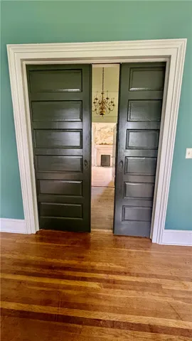 Another view of the pocket doors from inside the the front right bedroom.