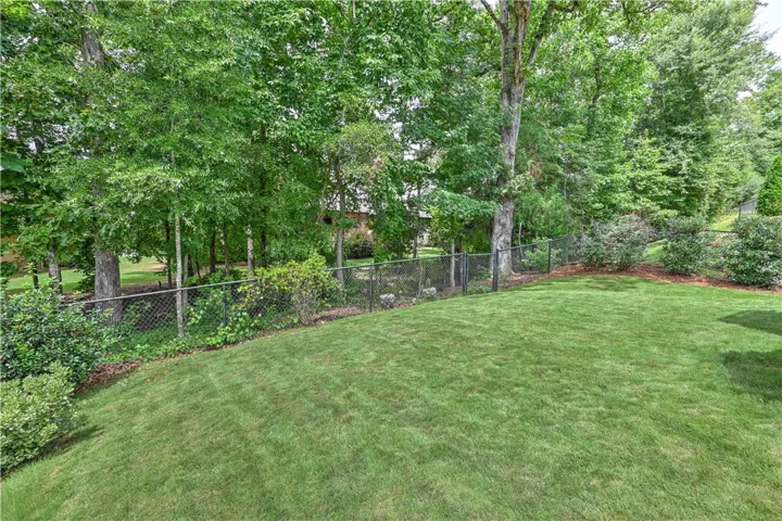 Lush, fully fenced backyard