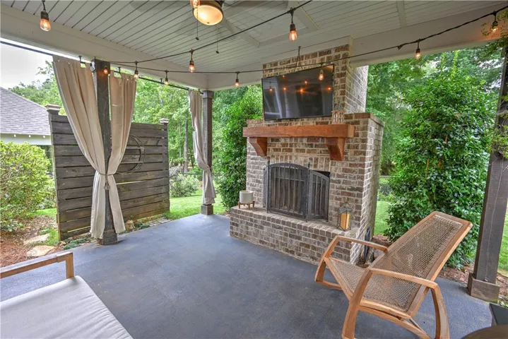 Spacious covered patio with fireplace