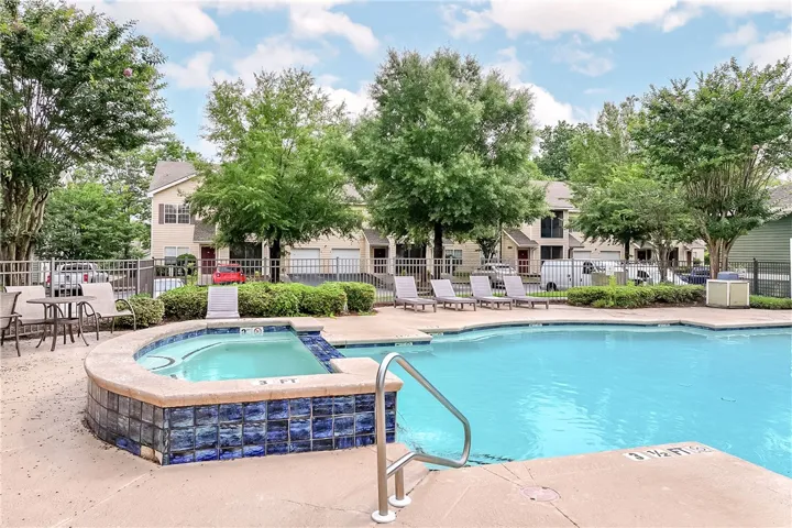 Relax poolside with a refreshing swim and adjacent hot tub in this inviting community oasis.