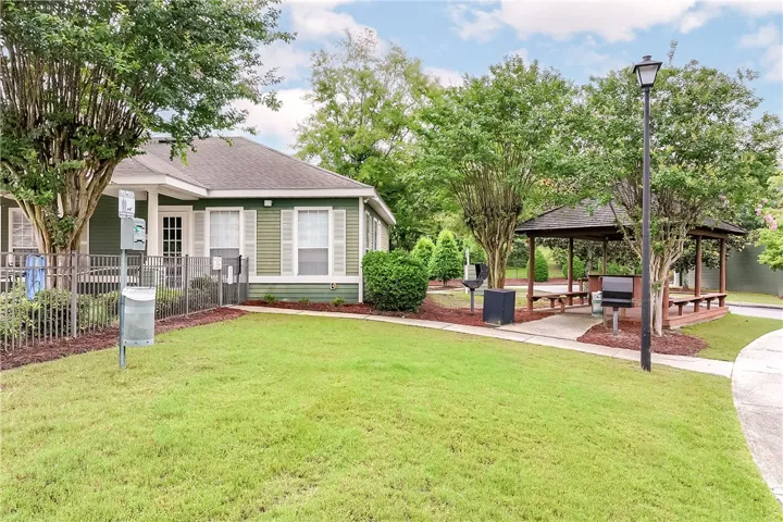 A well-maintained lawn with a charming gazebo, perfect for outdoor relaxation and gatherings.