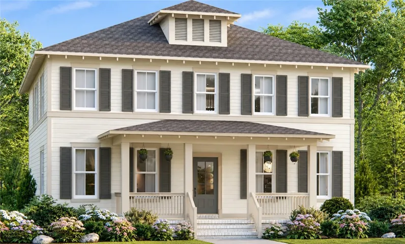 A welcoming front porch with classic columns anchors the facade of this two-story home.