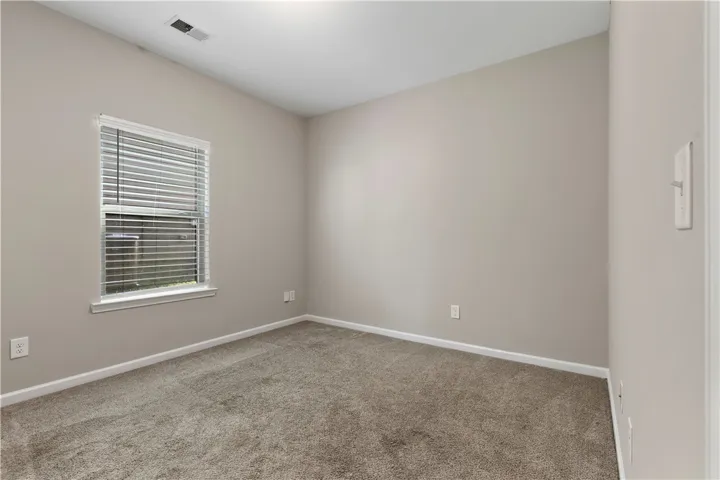Main level bedroom and bathroom