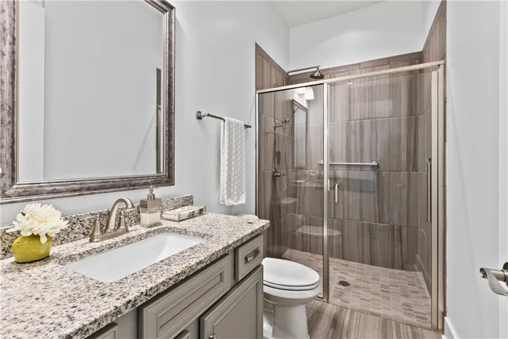 This bathroom is located on the right side of the home. Zero entry shower